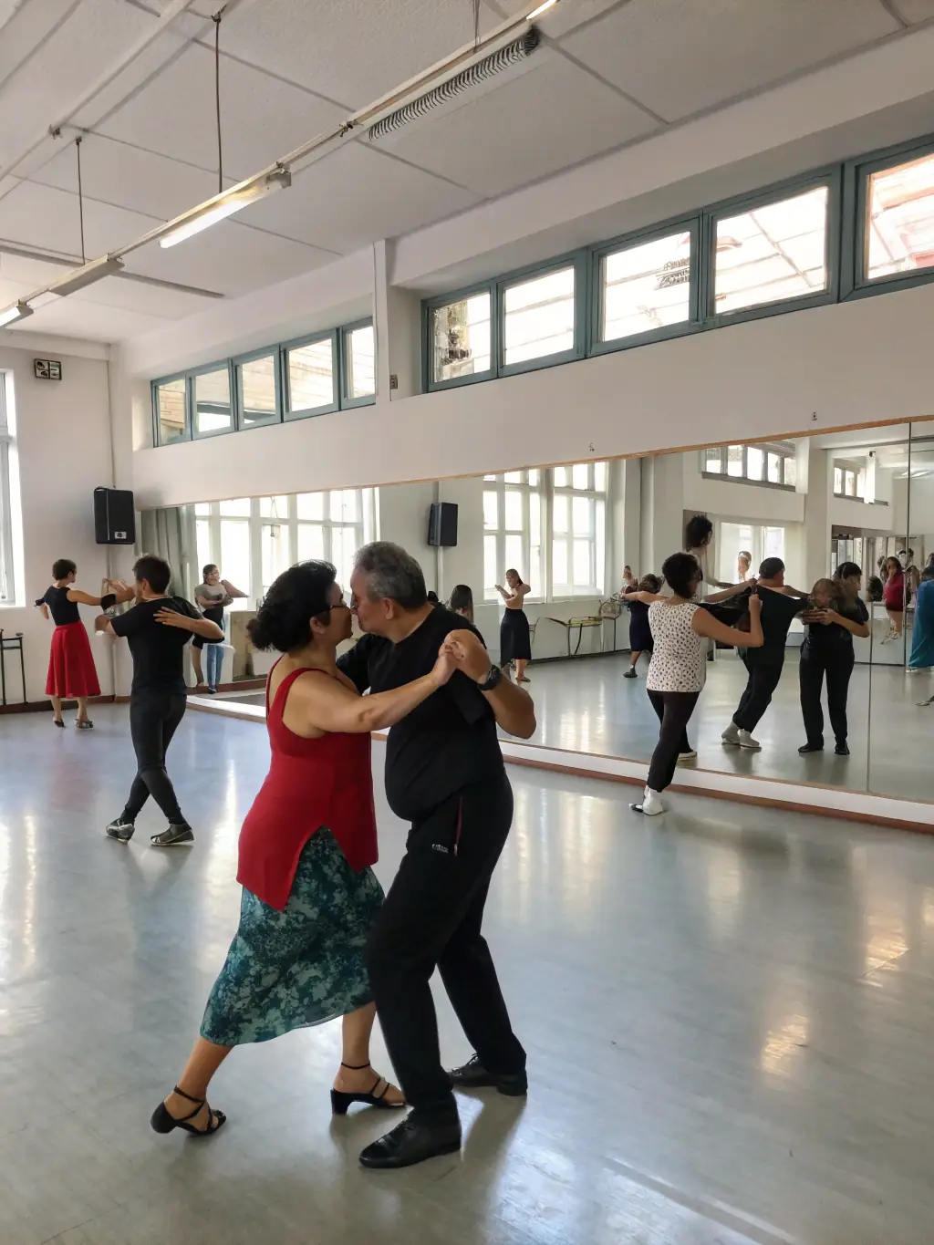 A dynamic image of a dance workshop in progress, featuring participants of various ages and backgrounds learning different dance styles, highlighting POL'ART's commitment to accessible artistic education.